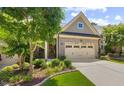 Home showcasing a brick facade, attached two-car garage, manicured landscaping at 122 Glenpark Pl, Cary, NC 27511