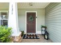 Front door featuring a Welcome mat and decorative wreath at 131 Abacos Ct, Clayton, NC 27520