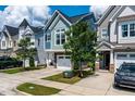 A view of multiple homes showcasing diverse architectural styles and manicured front yards at 1363 Brown Velvet Ln, Apex, NC 27523