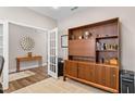 Well-lit office space with hardwood floors, french doors, and built-in shelving at 1633 Hillstar St, Fuquay Varina, NC 27526