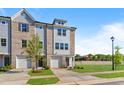Charming new construction townhome featuring a brick and siding facade and an attached one car garage at 1921 Fishamble St # 13, Fuquay Varina, NC 27526