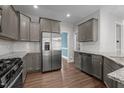 Well-equipped kitchen with stainless steel appliances, granite countertops, and ample cabinet space at 2057 Big Falls Dr, Wendell, NC 27591