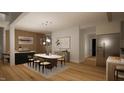 Elegant dining room with modern lighting, a sleek table, and stylish decor creating a welcoming atmosphere at 2344 Ballywater Lea Way, Wake Forest, NC 27587