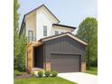 Contemporary home showcasing a mix of white and dark gray siding, complemented by green landscaping at 322 S Dixon Ave # R, Cary, NC 27511