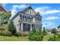Charming home featuring stone accents, mature landscaping, and a covered front porch at 503 Bendemeer Ln, Rolesville, NC 27571