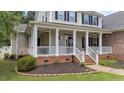 Close up of charming covered front porch with columns and decorative details at 81 Northcliff Ct, Clayton, NC 27527