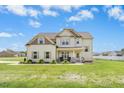 Lovely two-story home with a covered porch, set on a well-manicured lawn at 81 Olive Branch Dr, Smithfield, NC 27577
