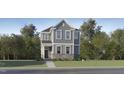 Charming two-story home with stone accents, gray siding, a well-manicured lawn, and mature trees at 876 Cassa Clubhouse Way, Knightdale, NC 27545