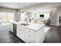 Spacious kitchen island with stainless steel dishwasher and open floor plan concept at 882 Nichols View Ct, Raleigh, NC 27604