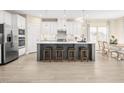 Modern kitchen featuring stainless steel appliances and a center island with seating at 884 Nichols View Ct, Raleigh, NC 27604