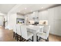 Bright kitchen with an island, bar seating, sleek appliances, and modern finishes for a stylish cooking experience at 892 Nichols View Ct, Raleigh, NC 27604