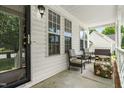 Inviting front porch with comfortable seating, perfect for relaxing and enjoying the outdoors at 99 Winwood Dr, Angier, NC 27501