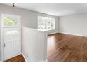 Inviting living room featuring hardwood floors, a modern paint scheme and lots of natural light at 102 Emerald Cir, Durham, NC 27713