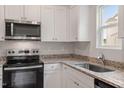 Bright kitchen featuring modern stainless steel appliances, granite countertops, and a stainless steel sink at 102 Flue Ct, Oxford, NC 27565