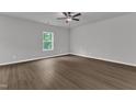 Bright bedroom with hardwood floors, a large window and fresh neutral paint at 111 Rhino Bnd, Oxford, NC 27565