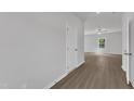 Bright and spacious living room with hardwood floors, neutral paint, and modern ceiling fan at 111 Rhino Bnd, Oxford, NC 27565