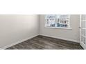 Bright room with wood-look floors and views of the neighborhood at 132 Pisgah St, Sanford, NC 27330