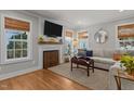 Bright living room featuring a fireplace, large sectional sofa, and stylish decor at 1811 Ridley St, Raleigh, NC 27608