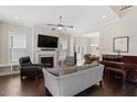 Bright and airy living room with fireplace, hardwood floors, and open floor plan at 220 W Winmore Ave, Chapel Hill, NC 27516