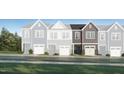 A rendering of new townhomes with covered garages, professional landscaping, and craftsman style elevations at 231 Paramount Dr, Smithfield, NC 27577