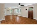 Elegant living room filled with natural light and features gleaming hardwood floors at 2609 Elmhurst Cir, Raleigh, NC 27610