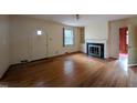 Living room features hardwood floors, fireplace, and arched entry at 2705 Royster St, Raleigh, NC 27608