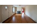 Spacious living room featuring hardwood floors, fireplace, and natural light at 2705 Royster St, Raleigh, NC 27608
