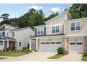Inviting two-story townhouse with a two-car garage and manicured lawn at 273 Millennium Dr, Pittsboro, NC 27312