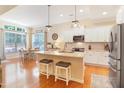 Bright eat-in kitchen featuring granite countertops, stainless appliances, and a breakfast nook with ample natural light at 3058 Hyco Lake Ct, Fuquay Varina, NC 27526