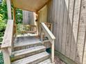 Inviting front porch with cozy seating, perfect for relaxing and enjoying the peaceful surroundings of the neighborhood at 406 Fairoaks Cir, Chapel Hill, NC 27516