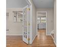 Inviting entryway featuring hardwood floors, with an open view to the kitchen at 4404 Susan Dr, Raleigh, NC 27603