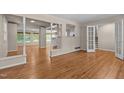 Spacious living room with hardwood floors, open to other rooms, and plenty of natural light at 4404 Susan Dr, Raleigh, NC 27603