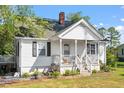 Quaint home with a covered porch perfect for relaxing at 506 Currin St, Durham, NC 27703