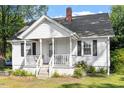 Inviting home boasting a classic front porch and swing at 506 Currin St, Durham, NC 27703