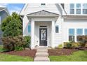 Close-up of the front entrance, showcasing the decorative wreath, tidy landscaping, and welcoming doorway at 1109 Hemby Ridge Ln, Morrisville, NC 27560