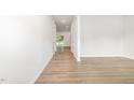 Bright, inviting hallway with light wood floors, leading to a view of the outdoors at 1113 Umstead Grove Way, Durham, NC 27712