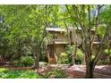Inviting townhouse surrounded by lush trees and beautiful landscaping at 113 Twisted Oak Pl, Durham, NC 27705
