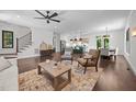 Bright living space showcasing hardwood floors and an open layout to the modern kitchen and dining at 1317 Fay St, Durham, NC 27701