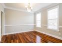 Elegant dining room features hardwood floors, crown molding, and lots of natural light at 165 Sutherland Dr, Franklinton, NC 27525