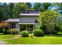 Charming two-story home with a well-maintained front yard and colorful landscaping at 206 Lisa Dr, Carrboro, NC 27510
