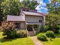 Charming two-story home with a well-maintained front yard and colorful landscaping at 206 Lisa Dr, Carrboro, NC 27510