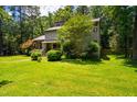 Charming two-story home with a well-maintained front yard and colorful landscaping at 206 Lisa Dr, Carrboro, NC 27510