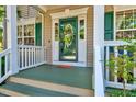 Inviting front porch with decorative glass door, neutral siding, and painted steps for a warm welcome at 3217 Enchanting Way, Raleigh, NC 27616