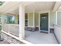 Welcoming front porch showcasing a stylish entrance and ample space for relaxation and decor at 3504 Regent Pines Dr, New Hill, NC 27562