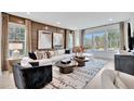 Spacious living room featuring a large white couch, modern decor, and lots of natural light at 5032 Jowetts Walk Dr # 26, Cary, NC 27519