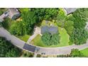 Aerial view of a home on a cul-de-sac, showcasing its expansive driveway and verdant surroundings at 5320 Middleton Rd, Durham, NC 27713