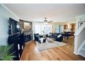 Spacious living room featuring hardwood floors, a fireplace, and plenty of natural light at 6229 Saybrooke Dr, Raleigh, NC 27604
