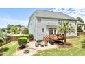 Spacious backyard featuring a deck, outdoor seating, patio, fire pit, and beautifully landscaped yard at 626 Toledo Ct, Rolesville, NC 27571