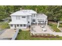 Aerial view showcases an expansive backyard with patio, pergola, and manicured lawn at 7920 E Washington St, Mebane, NC 27302