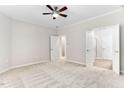 Spacious bedroom features neutral carpeting and ensuite bathroom at 112 Sabiston Ct, Cary, NC 27519